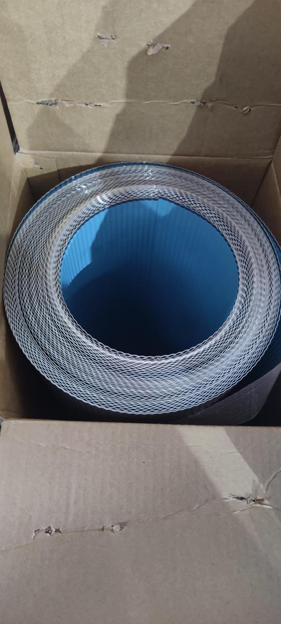 Supplied sample photograph of rolled corrugated aluminium with blue PSMR backing